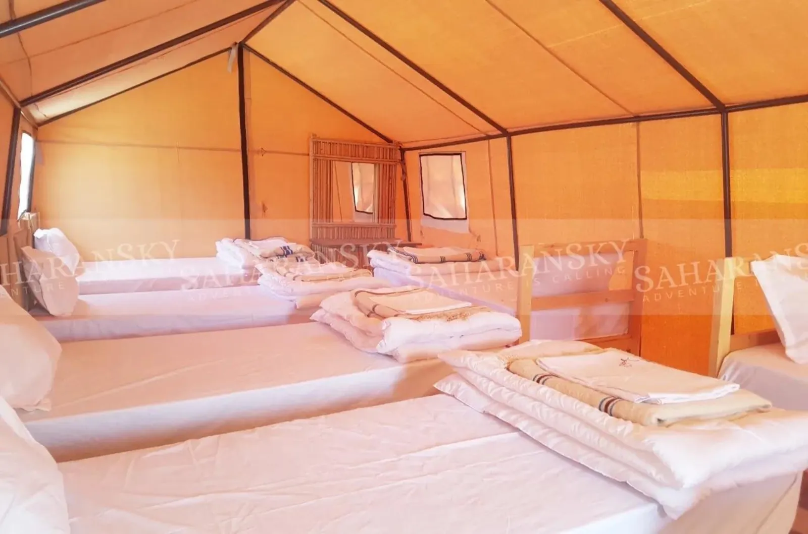 Beds made up inside a tent at the Douz desert camp